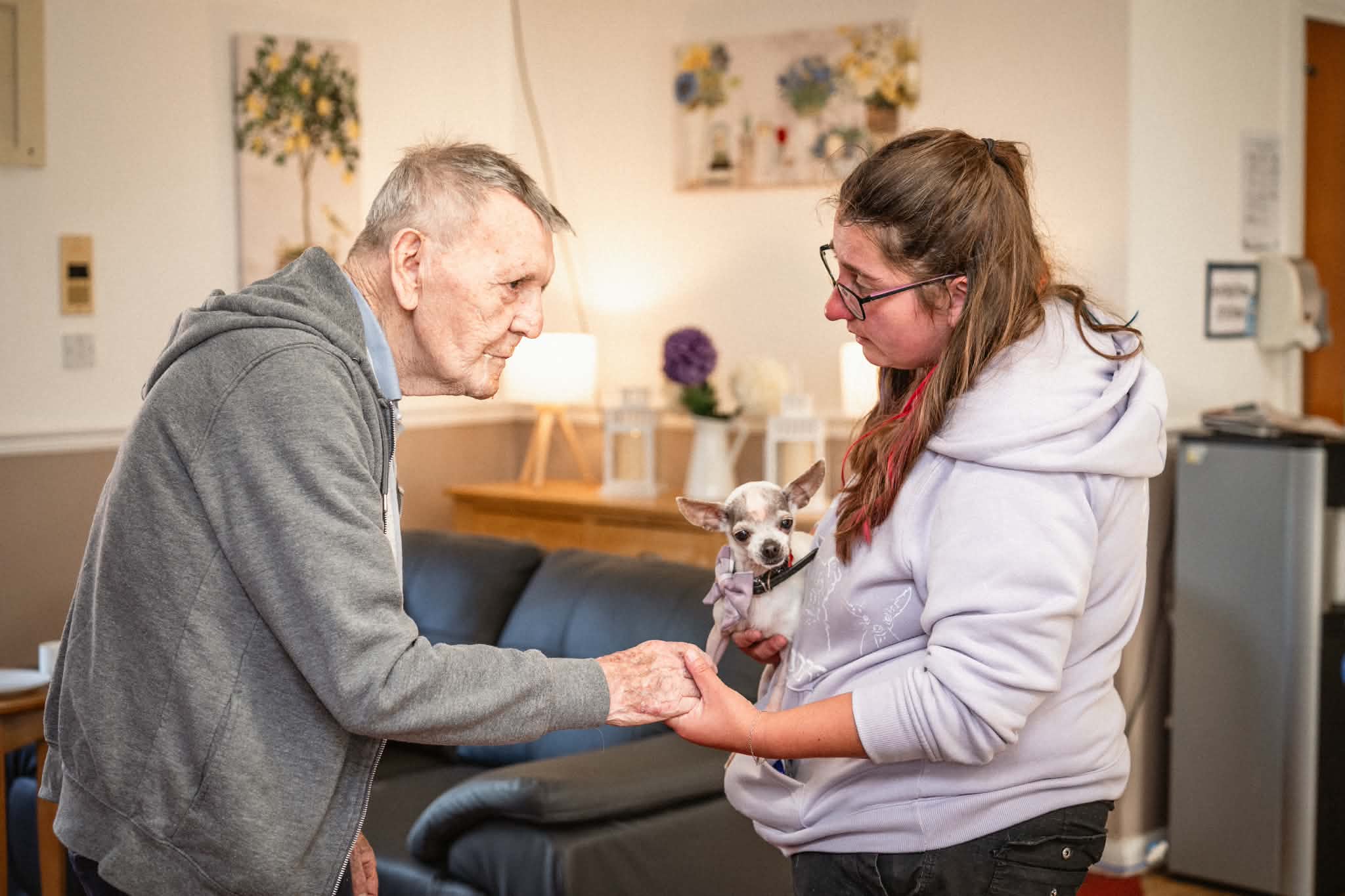 Maggie showing a chihuahua to an elderly man